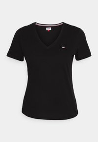 Czarna bawełniana koszulka z dekoltem w serek, krótki rękaw i małe logo na lewej piersi. Posiada subtelne szczegóły przeszycia na krawędzi.