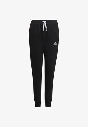 Černé tepláky z měkkého materiálu, s šňůrkou v pase, zúženými nohavicemi a malým bílým logem Adidas na levém stehně.