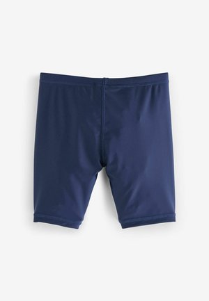 Bañador azul marino hecho de un tejido elástico, que presenta un ajuste ceñido, una textura suave y detalles de costura mínimos en la cinturilla y las piernas.