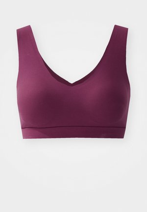Burgundy bra with a v-neck design, wide straps, and seamless construction. Made from smooth fabric with a soft texture.