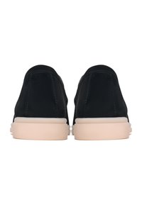 Black suede sneakers with a smooth texture, rounded design, and contrasting light beige rubber soles. No visible branding or accents.