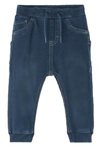 Navyblauwe joggingbroek gemaakt van zachte stof, voorzien van een elastische tailleband, trekkoord, zijzakken en contrasterende stiksel details.