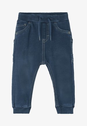 Námornícky modré jogger nohavice vyrobené z mäkkého materiálu, s elastickým pásom, šnúrkou na stiahnutie, prednými vreckami a kontrastnými švami.