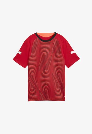 Piros sport póló hullám mintával és kontrasztos pöttyökkel, rövid ujjú, fekete gallérral. Logó a bal ujján.