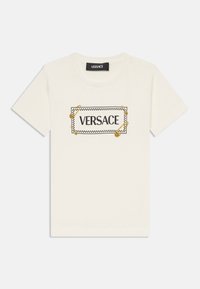 Seleccionado, white/black/gold coloured