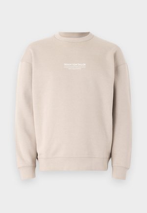 Sweatshirt bege feito de tecido suave com um design de gola redonda. Apresenta um logótipo em texto branco no peito e punhos e bainha canelados.