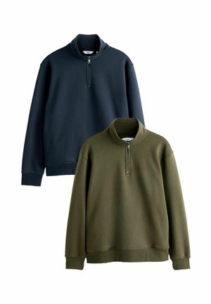 Two pullovers in dark navy and olive green, made of soft fabric. Both feature a high collar with a quarter-zip and elastic cuffs.