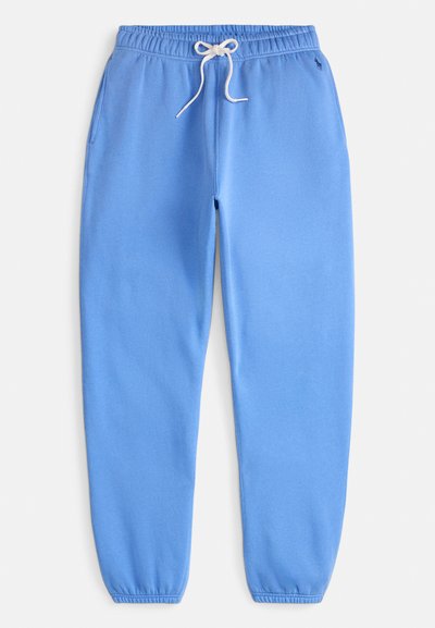 Lyseblå joggebukser laget av mykt stoff, med elastisk midjebånd med snor og innsnevrede mansjetter ved anklene.