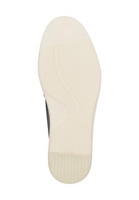 Suola della scarpa in gomma liscia color crema chiaro con motivo testurizzato, forma curva e scanalature flessibili per una migliore trazione.