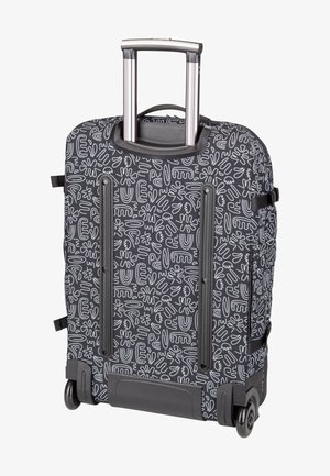 Valise noire à roulettes avec motifs abstraits blancs en lignes, poignée télescopique étendue, double roues et sangles de compression latérales.