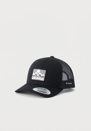 Casquette snapback en mesh noir avec patch logo montagne et texte "Columbia" à l'avant ainsi qu'une étiquette latérale, présentée en angle sur fond blanc.
