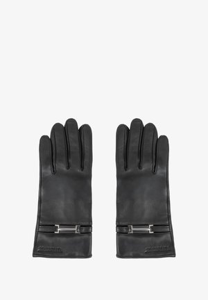Ein Paar schwarze Lederhandschuhe mit einem kleinen rechteckigen Metallelement nahe dem Handgelenk auf weißem Hintergrund.