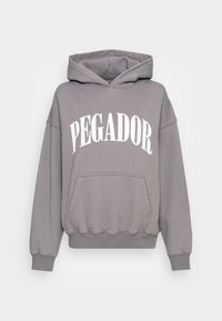 Grauer Kapuzenpullover mit Fronttasche, weiter Schnitt, gerippten Bündchen und großem weißem "PEGADOR"-Aufdruck auf der Brust. Weiches Baumwollmaterial.