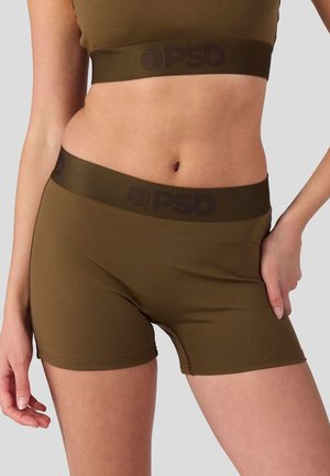 Olivgrüne Shorts aus dehnbarem Material mit einem breiten, dunkelbraunen Gummibund, der das "PSD"-Logo trägt. Glatte Oberfläche und enganliegendes Design.