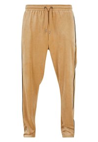 Lichtbruine fluwelen joggers met een elastische tailleband en trekkoord, voorzien van zwarte zijstrepen en een subtiele logodetail.