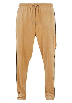 Light brown velvet joggers with an elastic waistband and drawstring, featuring black side stripes and a subtle logo detail.