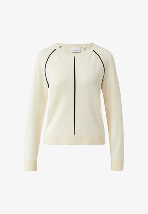 Cremefarbener Pullover mit langen Ärmeln, schwarzem vertikalem Streifen in der Mitte und schwarzer Paspelierung entlang der Raglanärmel, mit Rippbündchen an Ärmelenden und Saum.