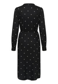 Robe midi noire à manches longues avec petits motifs blancs en losange, un col, des poignets boutonnés et une ceinture nouée à la taille, vue de dos.