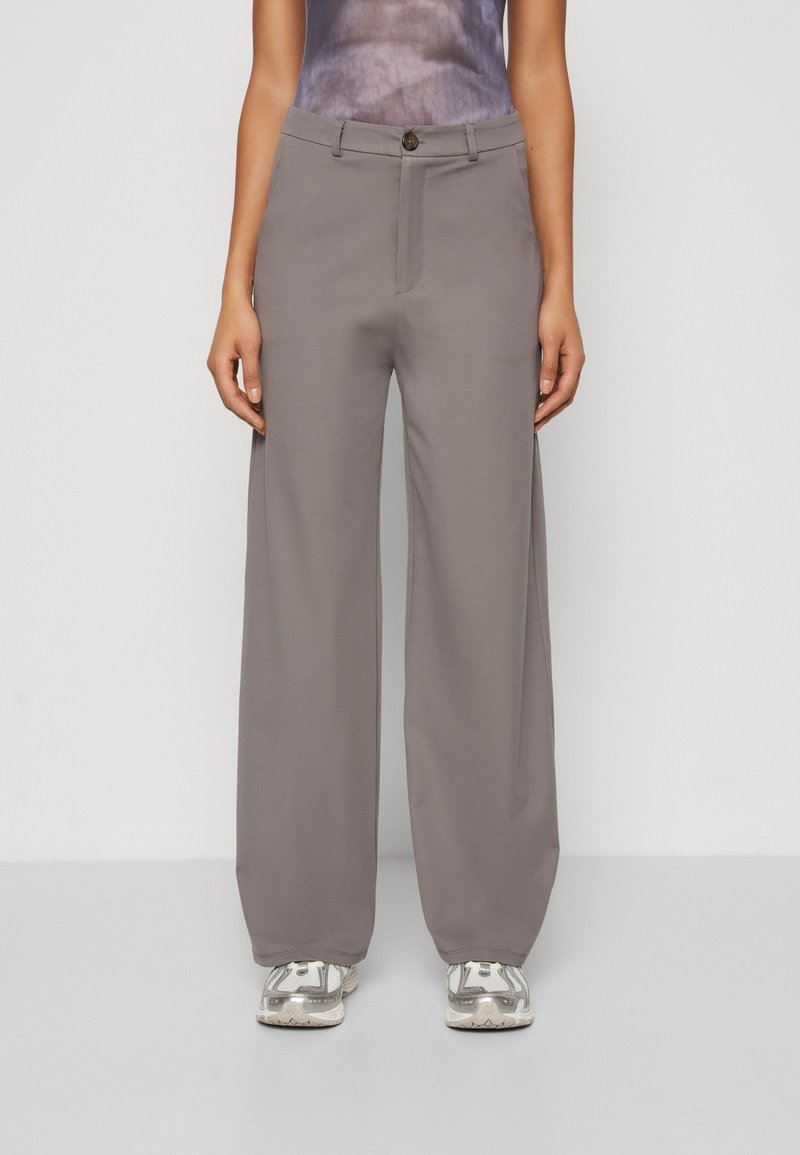 Light gray wide-leg trousers with a button closure, constructed from smooth fabric. Features a single front seam and relaxed fit.