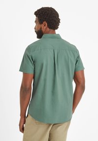 Short-sleeve green shirt in cotton fabric with a back yoke, straight cut hem, and subtle stitching details.