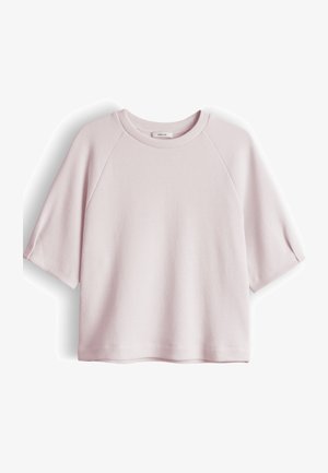 Light pink short-sleeve knit top with a round neckline and raglan sleeves, displayed flat on a white background.