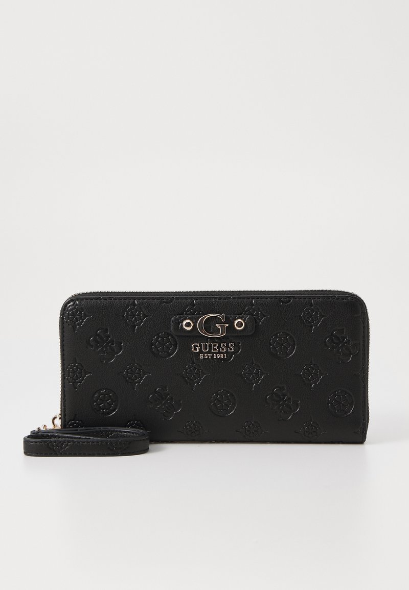 Portefeuille en cuir noir avec motif floral embossé, logo en métal doré, fermeture zippée et bandoulière amovible. Design rectangulaire compact.