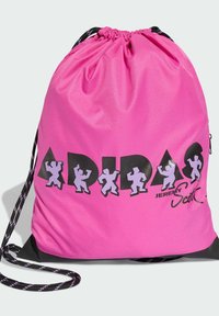 Pink drawstring bag with black bottom. Features black and purple graphic text “ADIDAS” and playful silhouettes. Adjustable black cord straps.
