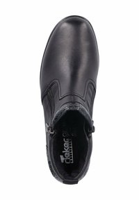 Bottines en cuir noir avec une finition lisse, des zips sur le côté, des coutures décoratives et un subtil accent texturé au niveau du talon.