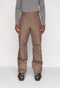 Hnedé snehové nohavice vyrobené z odolného materi�álu, s rovnými nohavicami, dvoma prednými gombíkmi a uvoľneným strihom okolo nôh.