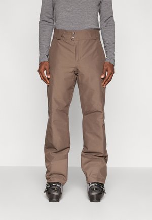 Ruskeat lumihousut, jotka on valmistettu kestävästä materiaalista. Ne ovat suoralinjaiset, niissä on kaksi etupainiketta ja rento istuvuus jaloissa.