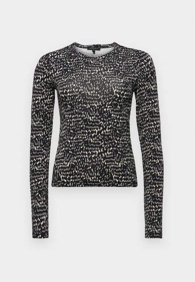 Långärmad svart topp med en texturerad, ojämn vit prickig mönstring, slim fit och rund halsringning. Slät tyg med lätt stretch.