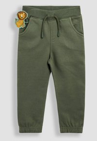 Olivengrønne sweatpants med elastisk talje og snor, der har en sidelomme og en løvepatch som accent på forsiden.