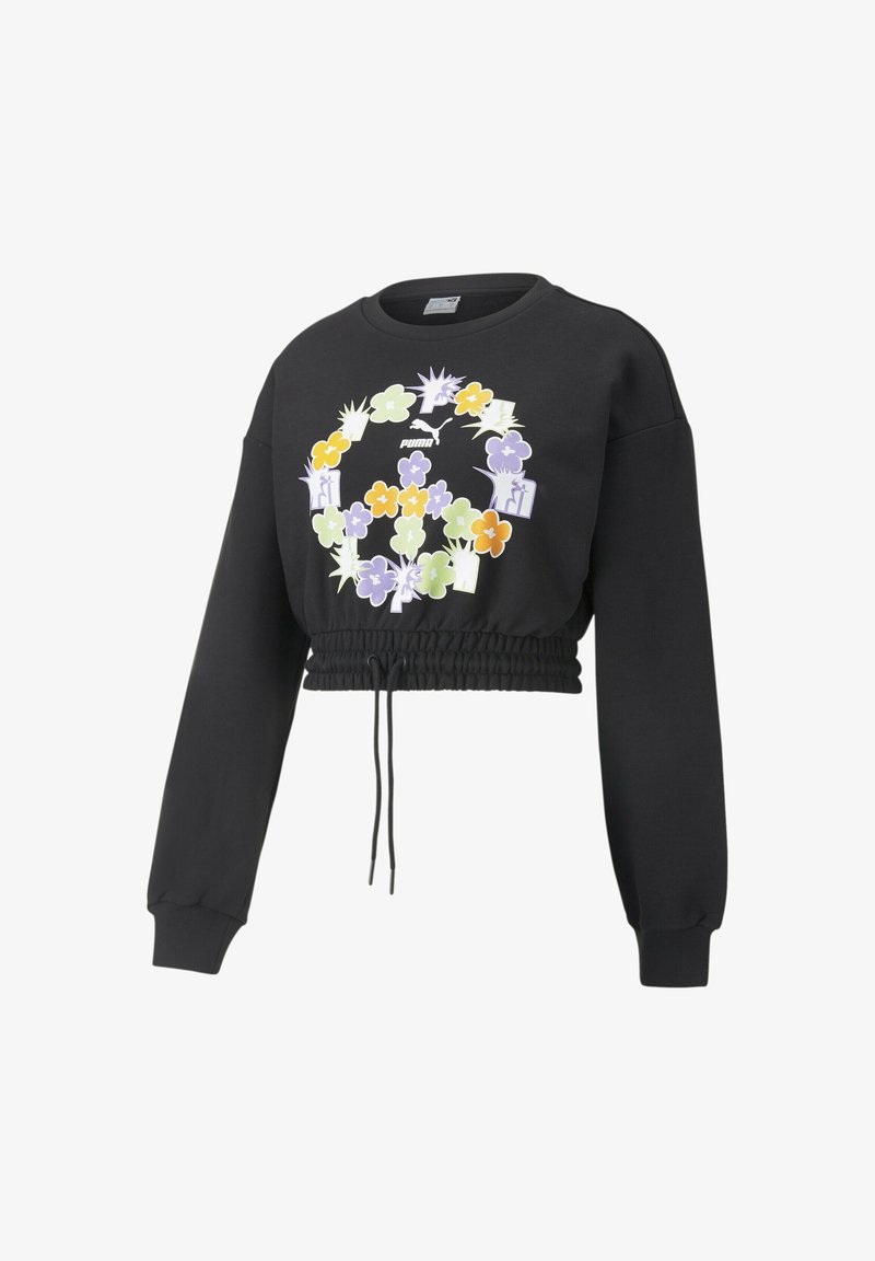 Sweat-shirt court noir à manches longues avec taille élastique et cordon, doté d’un motif floral coloré en forme de signe de paix autour d’un logo Puma sur la poitrine.