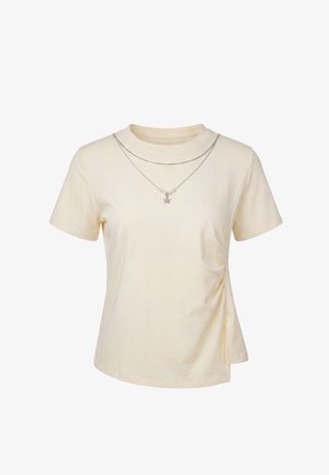 usha, Nyomott mintás póló - beige