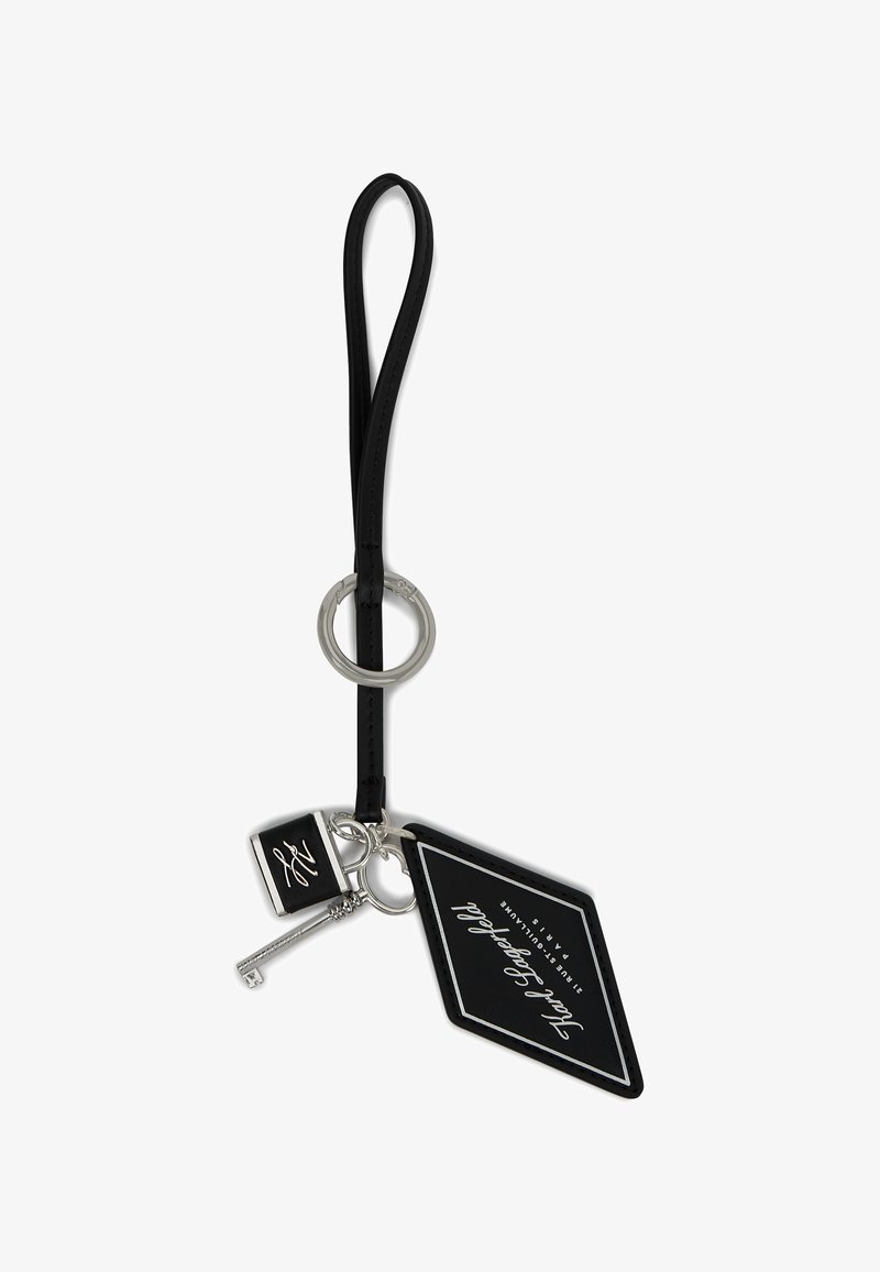 Mustmust põhjaga okümbernøid, valge teksti mustal taustal.