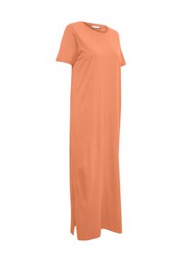 Robe en coton peach à manches courtes et longueur genou. Présente une coupe droite et des fentes latérales pour plus de liberté de mouvement. Design simple et sans ornements.