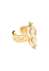 Gold-tone cuff bracelet featuring teardrop-shaped cream stones and small round gemstones. The design includes floral accents and smooth texture.