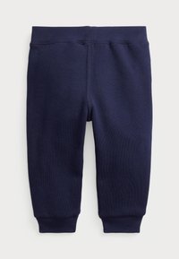 Navyblaue Sweatpants für Kleinkinder mit elastischem Bund und gerippten Bündchen an den Knöcheln, vor einem weißen Hintergrund präsentiert.