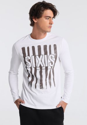 White long-sleeve t-shirt with a large brown graphic reading "SIXIS" and vertical stripes, made of soft cotton fabric.