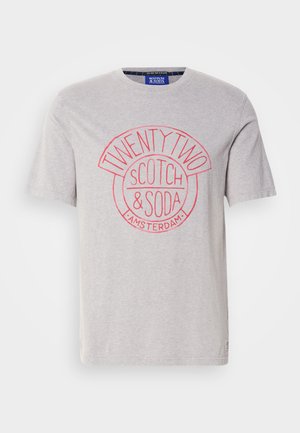 Grey cotton t-shirt featuring a round red graphic print with "TWENTY TWO", "SCOTCH & SODA", and "AMSTERDAM" text. Short sleeves, standard fit.