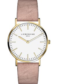Runde Uhr mit einem weißen Ziffernblatt, goldenen Akzenten und schlanken Stundenmarkierungen. Verfügt über ein hellrosa Lederarmband und ein minimalistisches Design.
