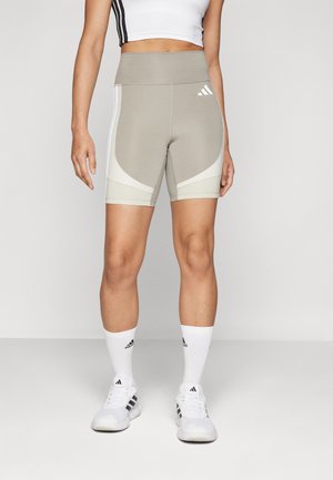 OPTIME ESSENTIALS STASH POCKET SHORT LEGGINGS - Tajice - putty beige