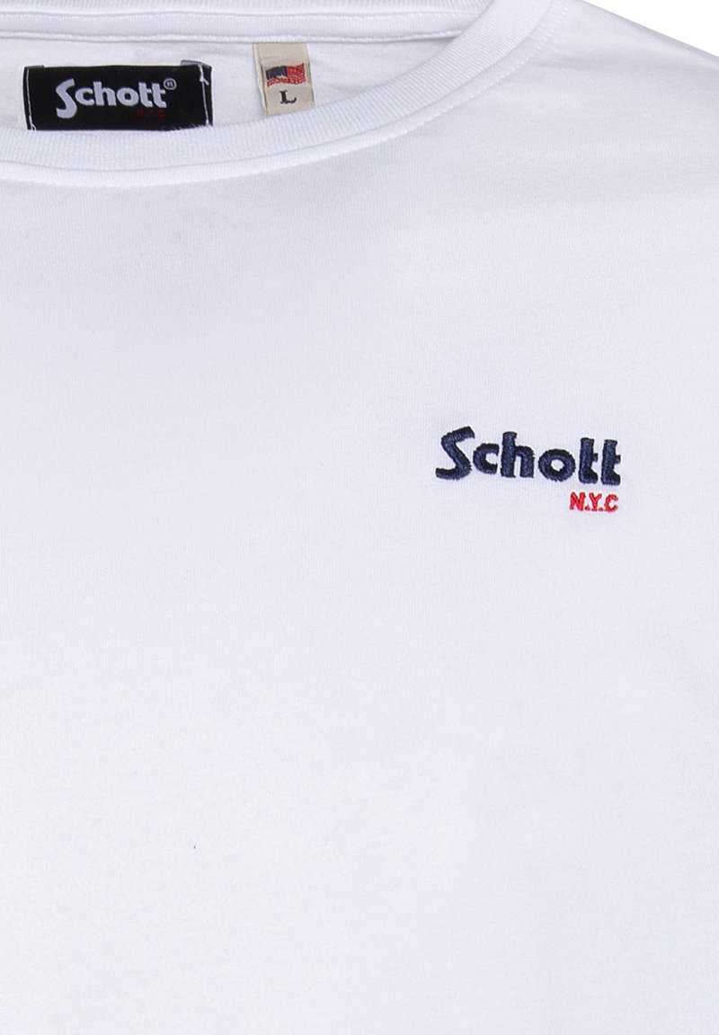 T-shirt en coton blanc avec un col rond, des manches courtes et un petit logo brodé en bleu marine et rouge sur la poitrine gauche.