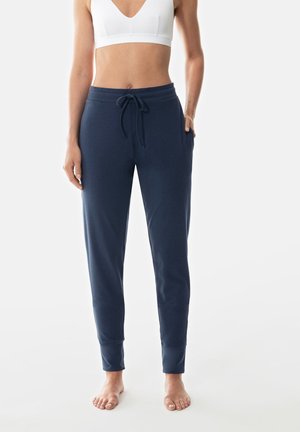 Pantalons de jogging bleu marine avec un waistband à cordon de serrage, poches latérales et poignets ajustés ; fabriqués à partir d'un tissu doux et lisse.