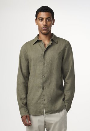 Olivgrünes Leinenhemd mit Button-Down-Kragen, langen Ärmeln und leicht strukturierter Oberfläche. Verfügt über Vorderknöpfe und einen lässigen Schnitt.