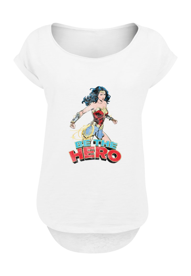 White short-sleeve t-shirt featuring a graphic of a female character in a red and gold outfit, with "BE THE HERO" text in bold colors.