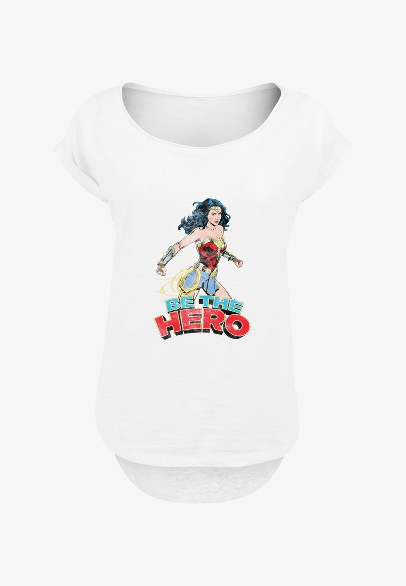 White short-sleeve t-shirt featuring a graphic of a female character in a red and gold outfit, with "BE THE HERO" text in bold colors.