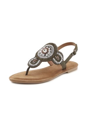 Olive green sandals with a decorative beaded embellishment, slender ankle strap, and a flat nude footbed. Soft suede texture with detailed patterns.