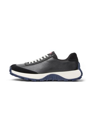 Black athletic shoe with white laces and a textured surface, featuring a contrasting blue sole and minimalist design, angled to show side profile.