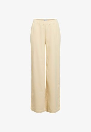 Pantalones de pierna ancha color beige con cintura elástica, confeccionados en un tejido texturizado con un sutil canalé y un ajuste holgado.